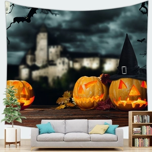 Detail of Halloween tapestry with glowing jack-o-lanterns and spooky castle above a sofa