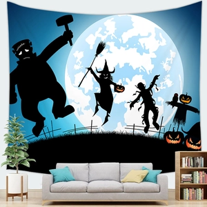 Detail of Halloween tapestry with moon and witch silhouettes hanging in a cozy living room