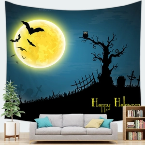 Detail of Halloween tapestry with full moon and owls hanging above a white sofa