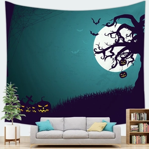 Detail of Halloween tapestry with pumpkin and full moon hanging above a modern sofa