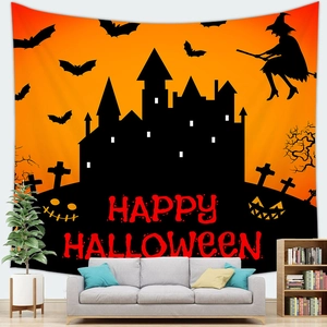 Detail of Halloween tapestry with castle, pumpkin and Happy Halloween text on peach skin fabric