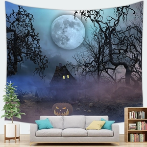 Detailed view of spooky Halloween night tapestry with pumpkins hanging above a grey sofa