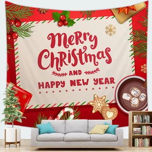 Detail of Christmas wall tapestry with festive motifs hanging over a grey sofa