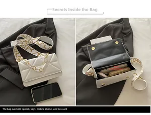 Detail view of white quilted shoulder bag with chain strap and spacious inner compartment