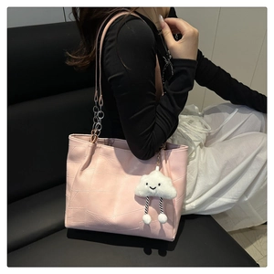 Pink patchwork tote bag with gold chain strap and cute cloud charm detail