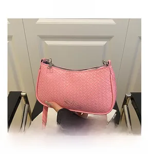 Detail of pink woven texture on PU leather hobo bag with high-quality silver metal zipper