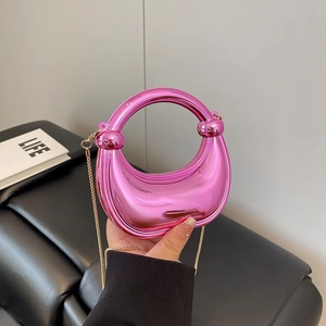 Borsa a mano rosa metallizzata in acrilico laser con catena dorata per feste e serate
