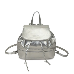 Minimalist silver metallic backpack with drawstring and flap closure on white background