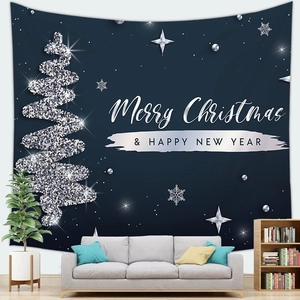 Cozy home interior featuring a navy blue Christmas tapestry above a modern gray sofa