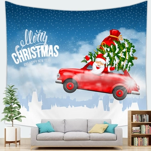 Cozy home interior featuring a Christmas tapestry with Santa and trees over a gray sofa