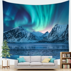 Starry sky and aurora borealis tapestry above sofa in a modern minimalist living room