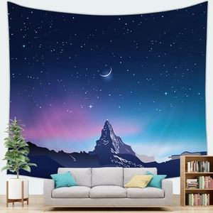Starry night sky tapestry with snow mountain silhouette hanging above a modern sofa