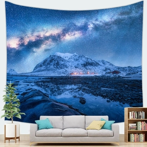 Starry night sky tapestry featuring snow mountains and lake in a modern living room