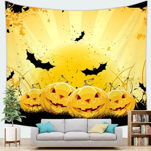 Detailed Halloween wall tapestry with smiling pumpkins and bats hung over a living room sofa