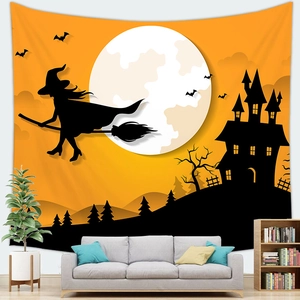 Detail of Halloween tapestry with witch and haunted castle motifs in a living room setting