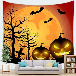 Detail of Halloween tapestry featuring pumpkins and full moon hanging over a gray sofa