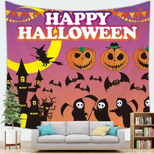 Happy Halloween tapestry featuring witches and pumpkins hanging above a gray sofa in a living room