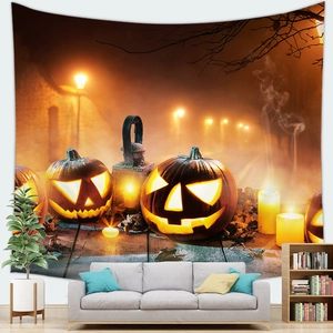 Detail of Halloween tapestry with glowing pumpkins and candles on a living room wall
