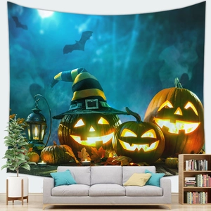 Detail of Halloween pumpkin tapestry featuring witch hat and lanterns in a cozy living room