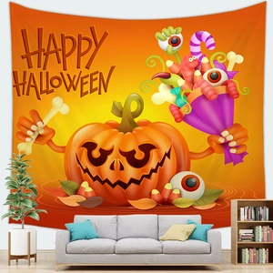 Detail of Happy Halloween tapestry with cartoon pumpkins and candy on a living room wall