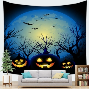 Halloween pumpkin tapestry with bats and moon displayed over a sofa in a modern living room