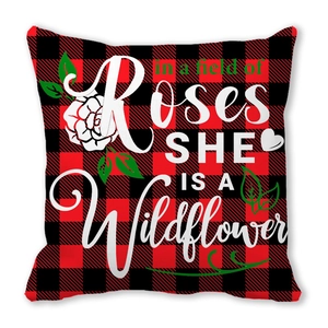 Buffalo plaid peach skin pillowcase with floral quote in a field of Roses She Is A Wildflower