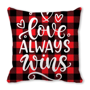 Red and black buffalo plaid pillow cover with LOVE ALWAYS WINS print and white hearts