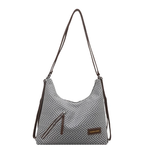 Gray and white herringbone woven shoulder bag with dark brown straps and zipper detail