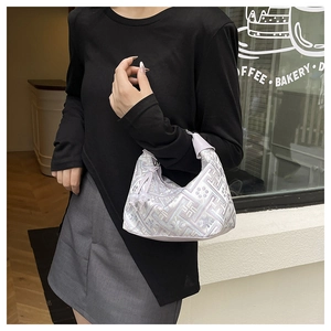 Detail of light purple tote bag with geometric floral texture and leather handle