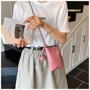 Pink lychee grain leather crossbody phone bag with a stylish woven rope shoulder strap