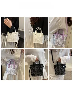 Detailed views of geometric patterned bucket bag worn as handbag and crossbody