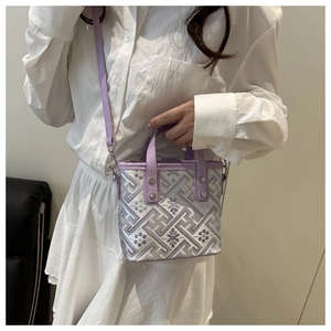 Close-up of purple and white jacquard square handbag with vintage geometric patterns
