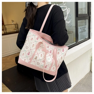 Detail of pink cartoon tote bag with textured bubble fabric and shoulder strap