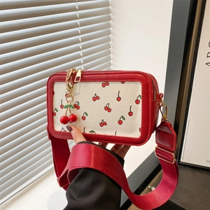Stylish white crossbody bag with red cherry print and cherry charm for summer