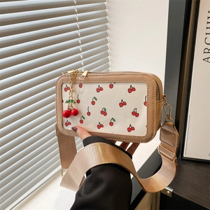 Chic beige square crossbody bag featuring cherry print and transparent window design