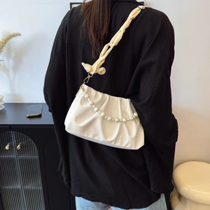 Elegant off-white pleated cloud bag with pearl chain and bow strap detail