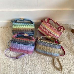 Colorful woven bohemian mini handbags with leather straps and gold hardware details