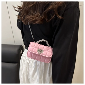 Pink quilted leather mini bag with decorative pearl handle and silver chain strap