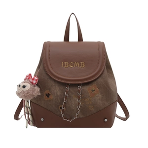 Brown vintage-style school backpack with bear prints and a plush bear keychain charm