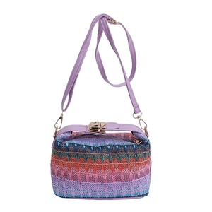 Colorful hand-woven straw crossbody bag with purple leather strap and gold buckle detail