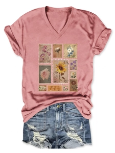 Detail of V-neck dusty rose T-shirt with vintage floral stamp print and denim shorts