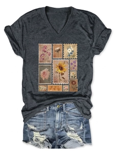 Detail of vintage stamp floral print on dark grey V-neck short sleeve T-shirt