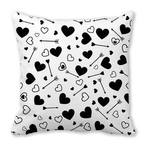 Square peach skin pillowcase with black heart and Cupid arrow patterns on white background