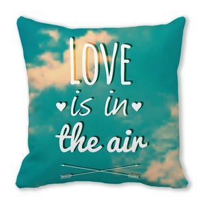 Teal square pillow with clouds and LOVE is in the air text design for Valentine decoration