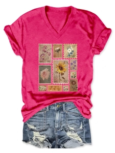 Flat lay of pink V-neck T-shirt with retro flower stamp prints and ripped denim shorts