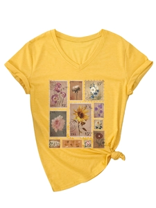Detail of yellow V-neck T-shirt featuring vintage floral stamp prints and a knotted hem