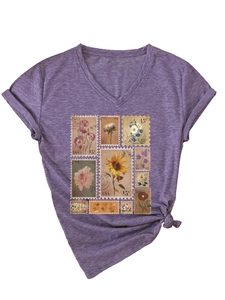 Detail of purple V-neck T-shirt showing vintage floral stamps and soft knit texture