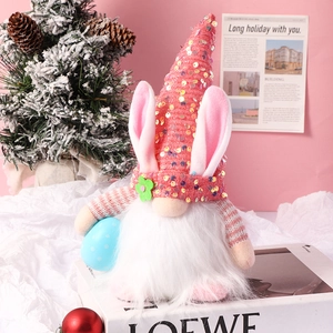 Detail of Easter gnome featuring pink sequin hat and blue polka dot egg ornament