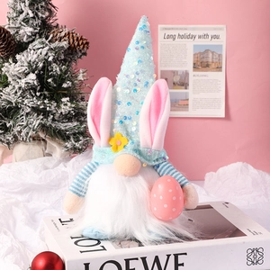 Detail of Easter gnome featuring sequined hat with rabbit ears and a pink polka dot egg