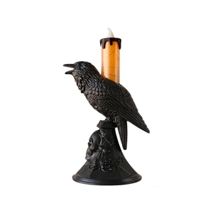 Halloween crow lantern with skull base and orange LED candle featuring spiderweb patterns